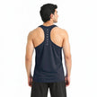Men's ZAKWEAR pack of three tank tops for workout, gym, and everyday wear, shown in a casual indoor setting.